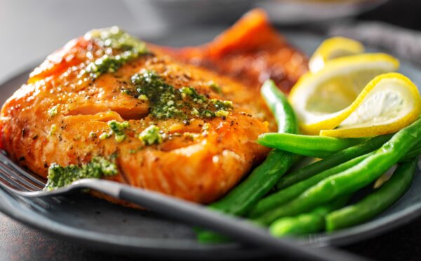 Closeup of baked salmon fish with green beans CHILLY FISH